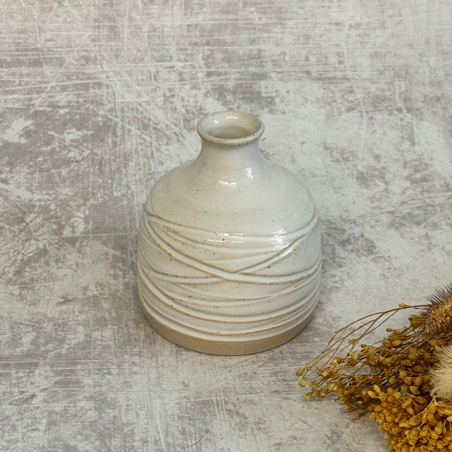 Carved bud vase - white